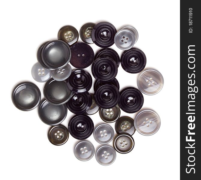Pile of Vintage buttons from overhead isolated on white.