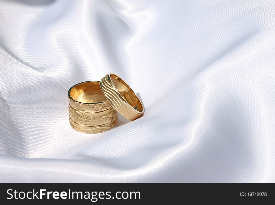 Wedding rings on the satin/silk surface. Wedding rings on the satin/silk surface