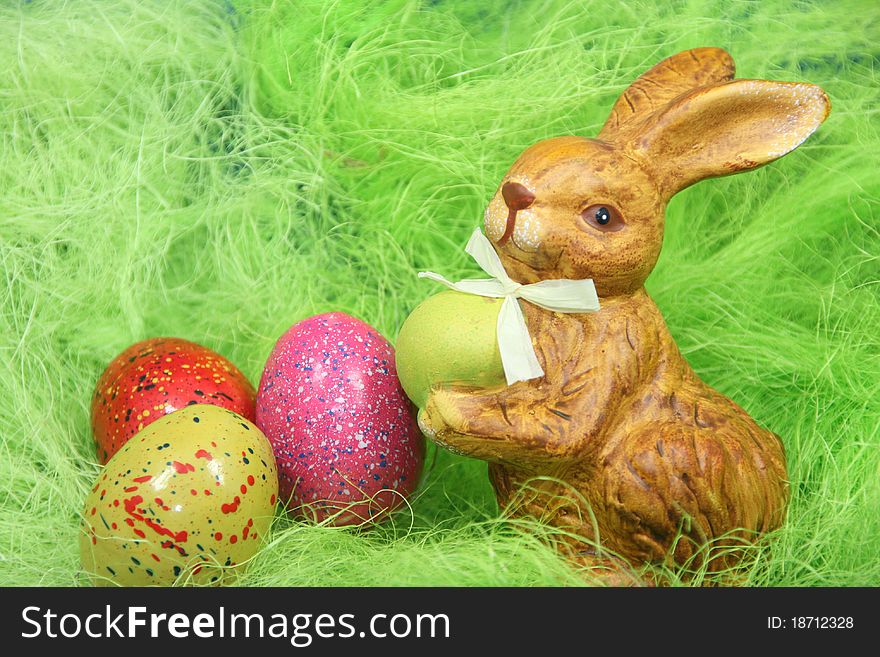 Cute easter bunny with eggs in a nest. Cute easter bunny with eggs in a nest.