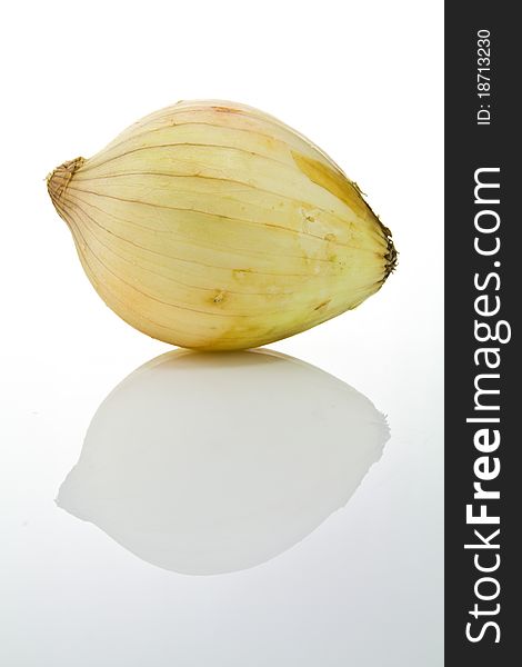 An fresh onion with shadow on white background. An fresh onion with shadow on white background