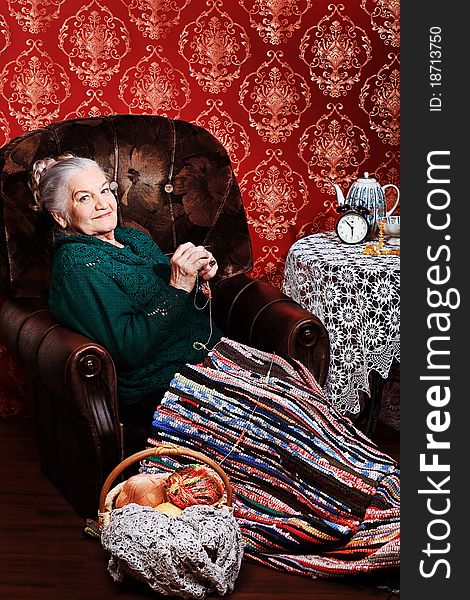 Portrait of a smiling senior woman having a rest at home.