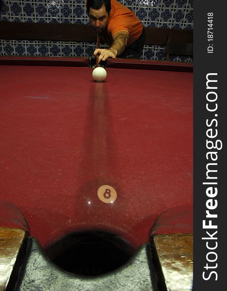 Person playing snooker