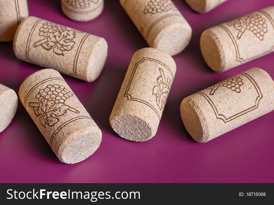 Wine corks scattered on a colorful background