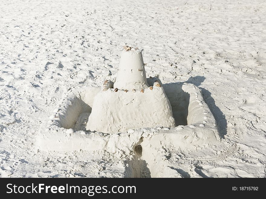 Beautifully crafted sand castle built on a summer holiday. Beautifully crafted sand castle built on a summer holiday