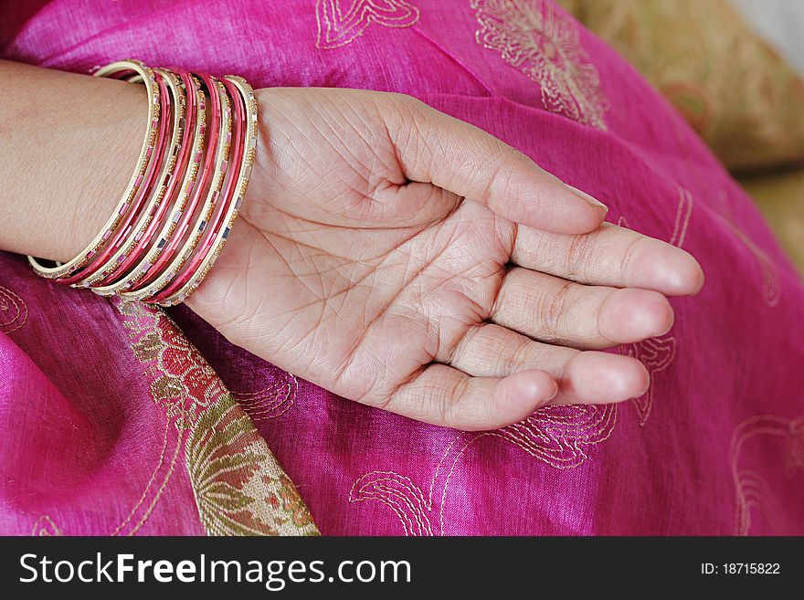 Traditional indian bangles worn by an indian woman. Traditional indian bangles worn by an indian woman