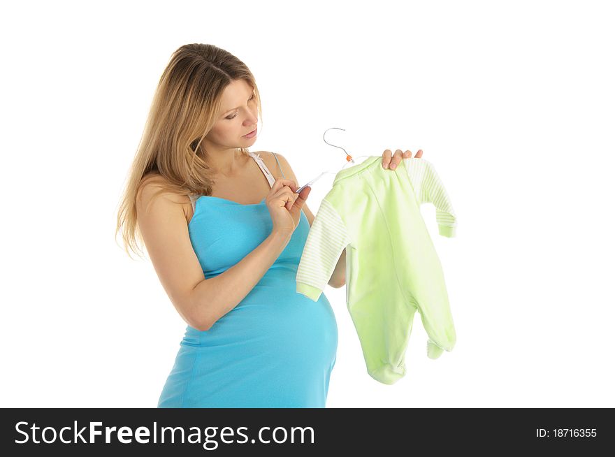 Pregnant woman buying baby clothes isolated on white