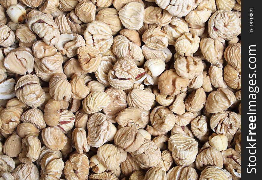 Dried chestnuts used as food ingredients in Chinese desserts and cuisine. For food and beverage, and nutritional concepts. closeup, background