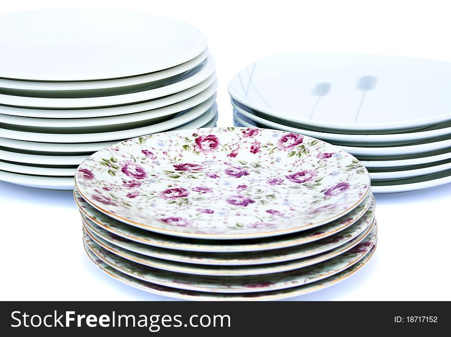 Stacks of plates isolated on white background.