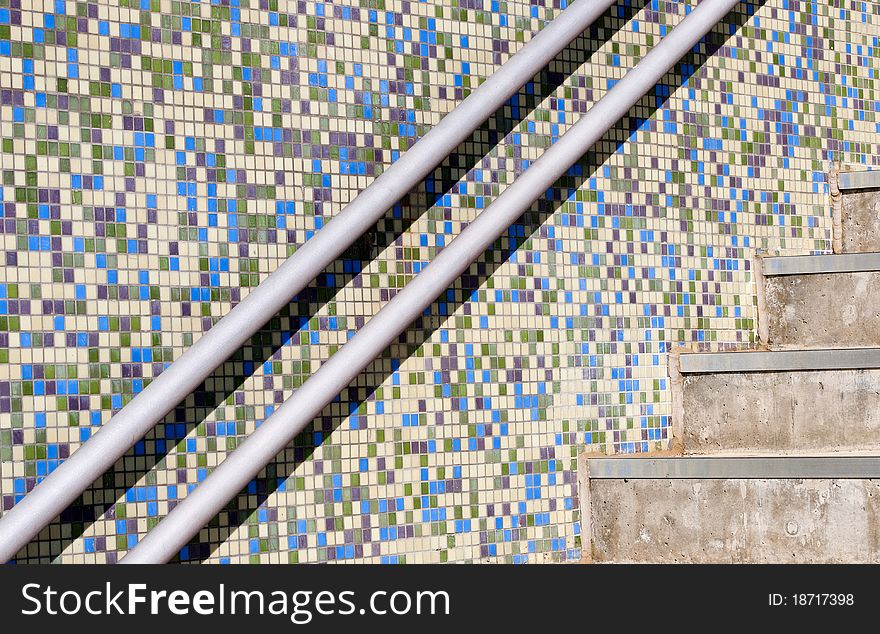 Modern external stairs and a colorful mosaic wall. Modern external stairs and a colorful mosaic wall.