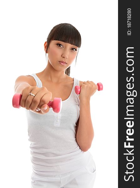 A fit and healthy young woman exercising with hand weights. White background. A fit and healthy young woman exercising with hand weights. White background.
