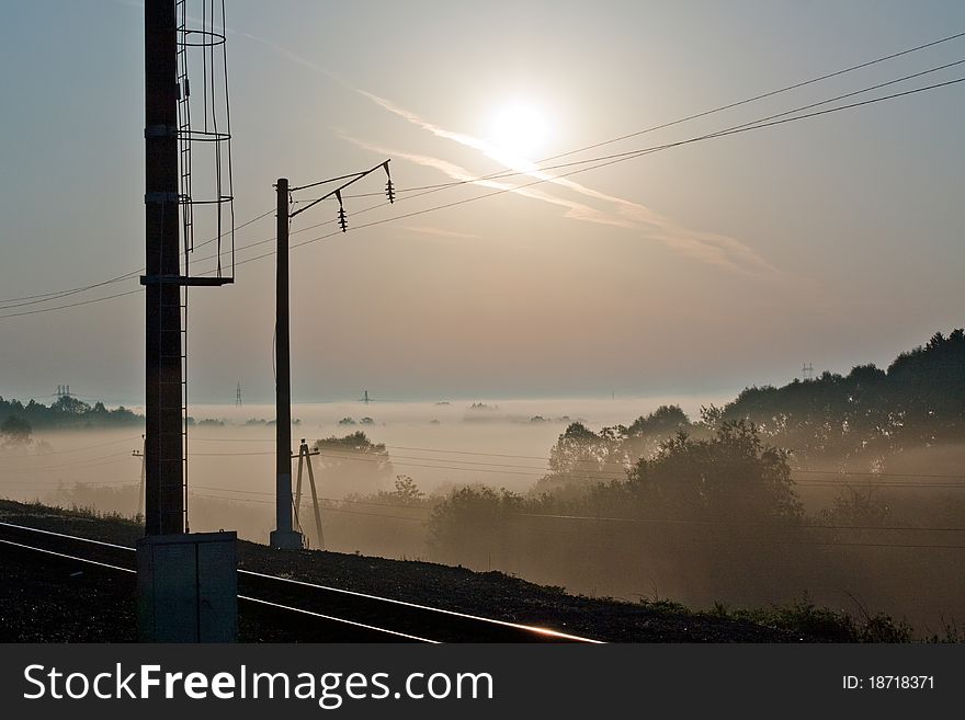 Sunrise over a misty meadow