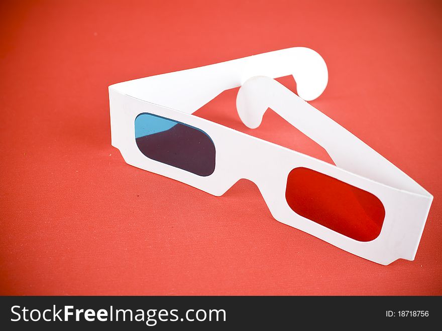 3D glasses on red background