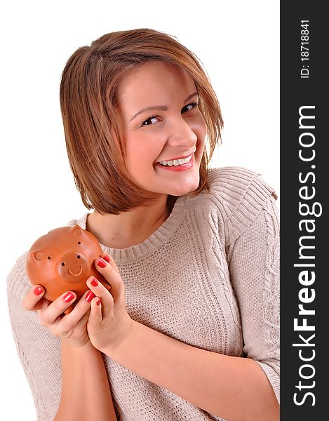 Smiling female holding piggy-bank