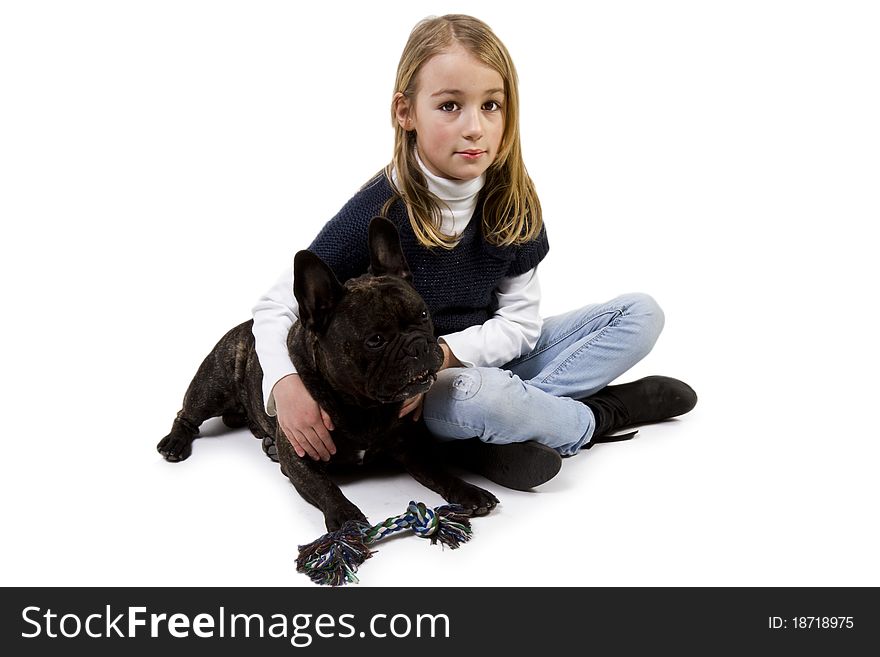 French bulldog and little girl playing isolated on white background