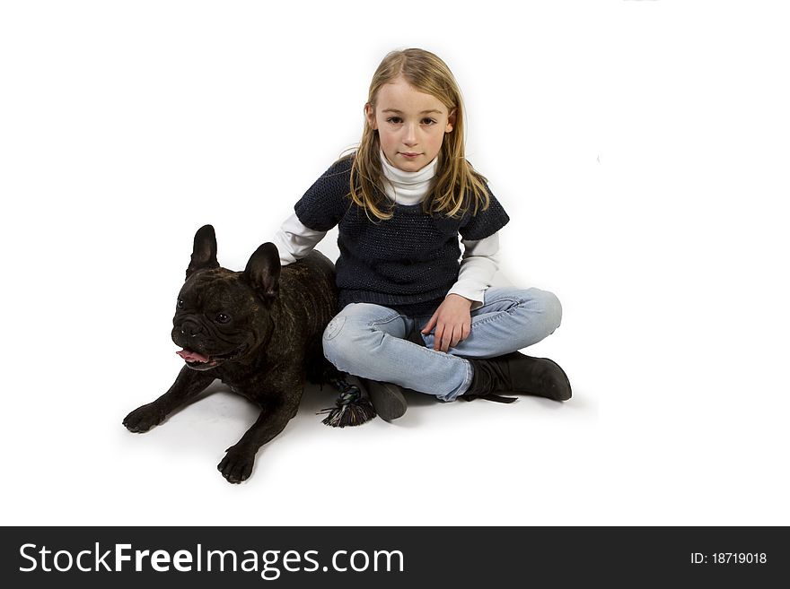 French bulldog and little girl playing