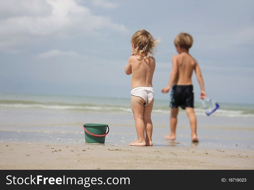 Two children playing on beach