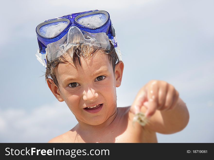 Boy In Diving Mask On Sea Background