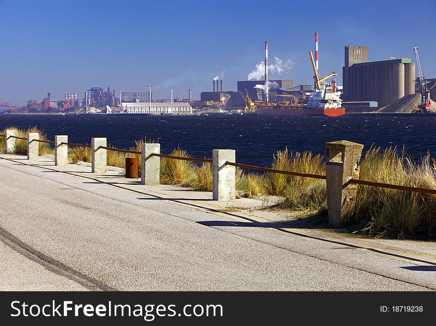 A large industrial dockland area containing a variety of refining and manufacturing plants