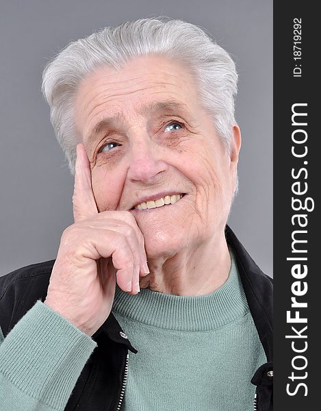 Old, attractive Caucasian woman thinking