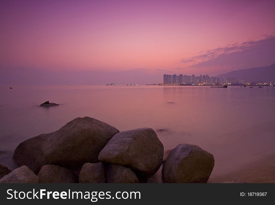 Sunset under long exposure along seashore