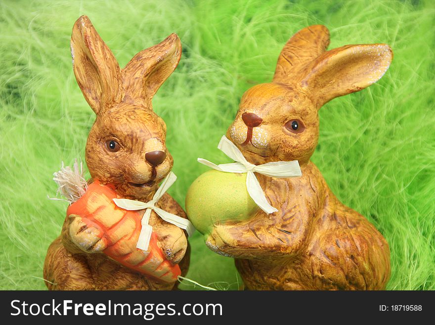 Cute easter bunnies with eggs in a nest. Cute easter bunnies with eggs in a nest.