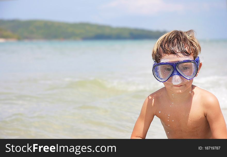 Boy In Diving Mask On Sea Background