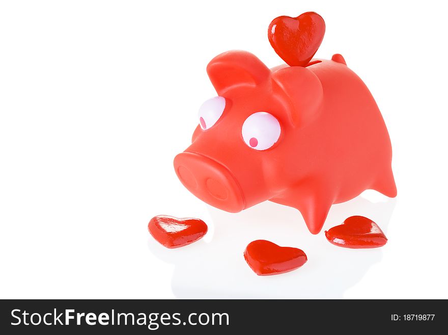 Piggy Bank and Red Heart isolated on white background