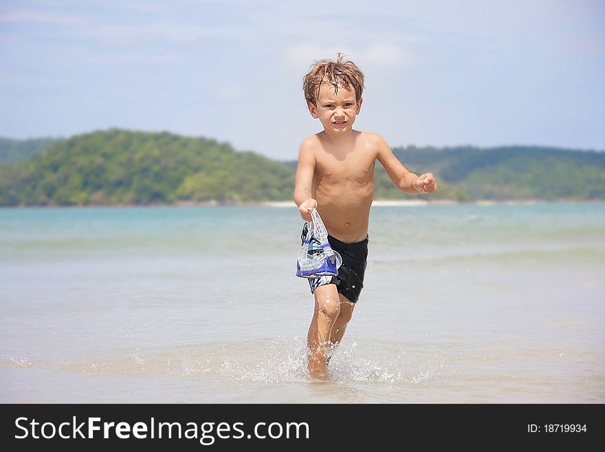 Boy In Diving Mask On Sea Background