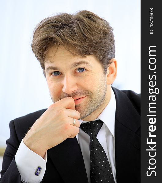 Portrait of smiling business man alone