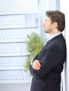 Young Businessman Standing In Office Stock Images