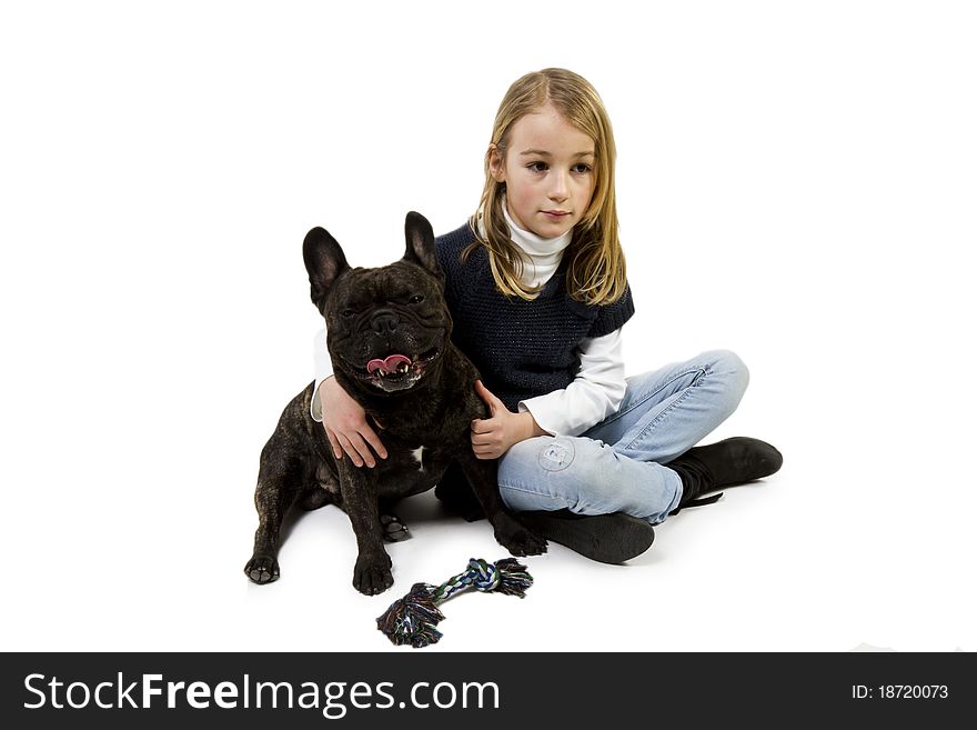 French bulldog and little girl playing isolated on white background