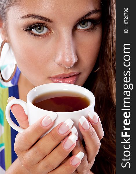 Beauty woman with fresh cup of black tea. Beauty woman with fresh cup of black tea