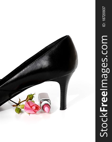 Pumps and rose against white background. Pumps and rose against white background