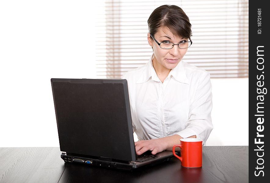 Young adult businesswoman at desk