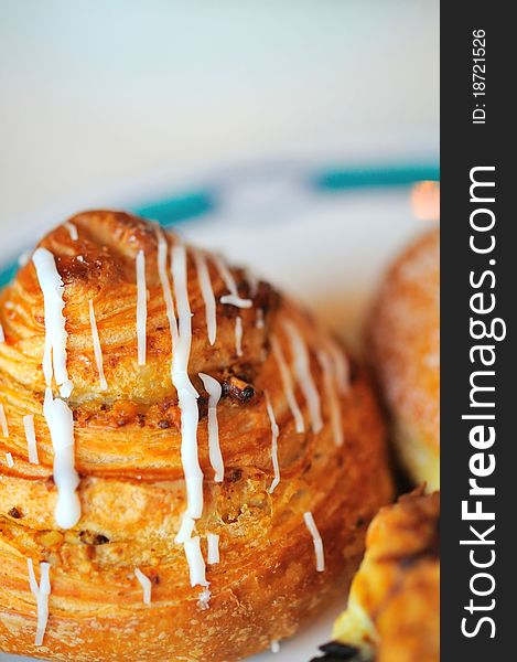 Closeup shot of freshly baked pastry on plate. Closeup shot of freshly baked pastry on plate.