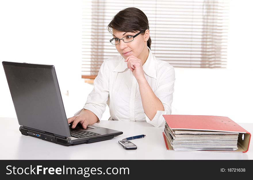 Young adult over-worked woman at desk