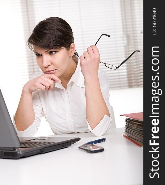 Young adult over-worked woman at desk