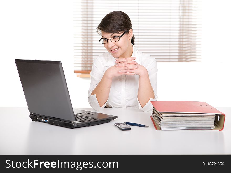 Young adult over-worked woman at desk