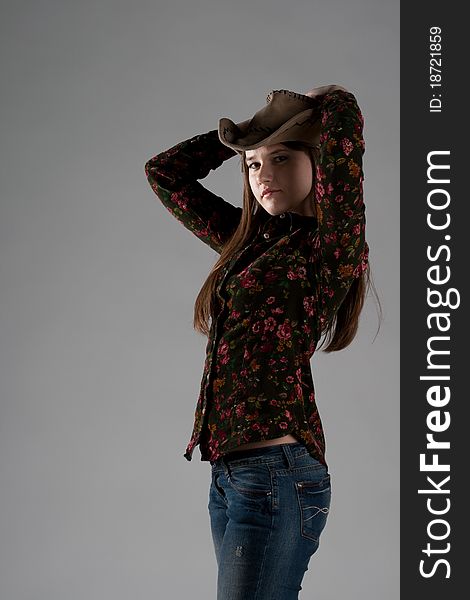 Attractive cowgirl portrait on white background