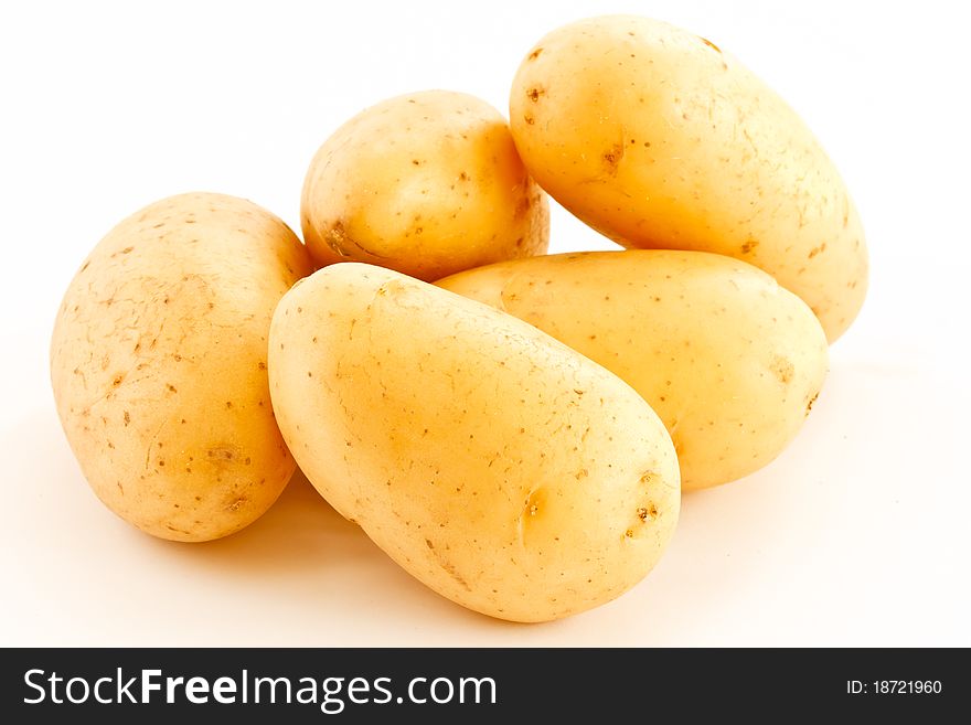Young, fresh potatoes are isolated on a white background. Young, fresh potatoes are isolated on a white background