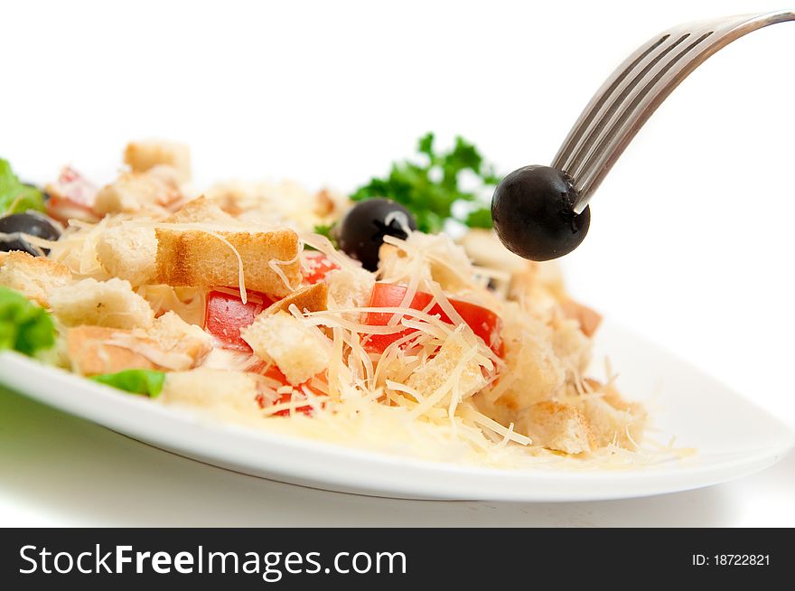 A salad in a stylish white bowl. A salad in a stylish white bowl.