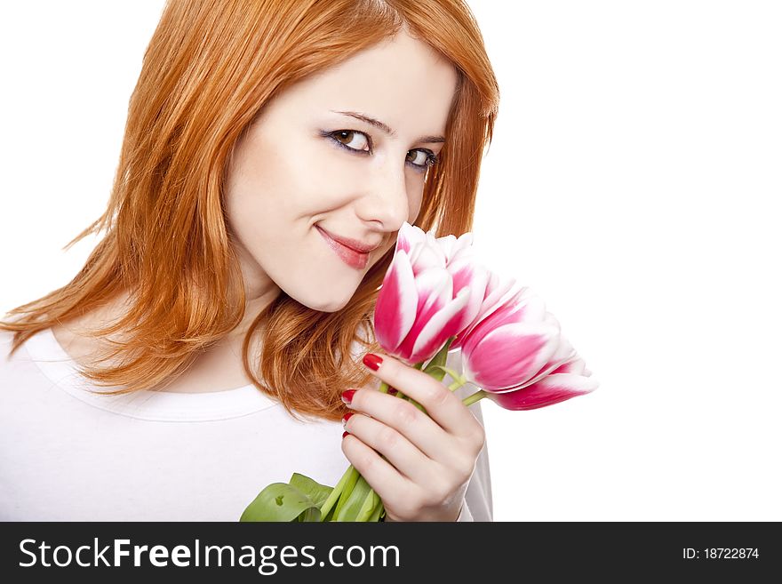 Beautiful red-haired girl with tulips.
