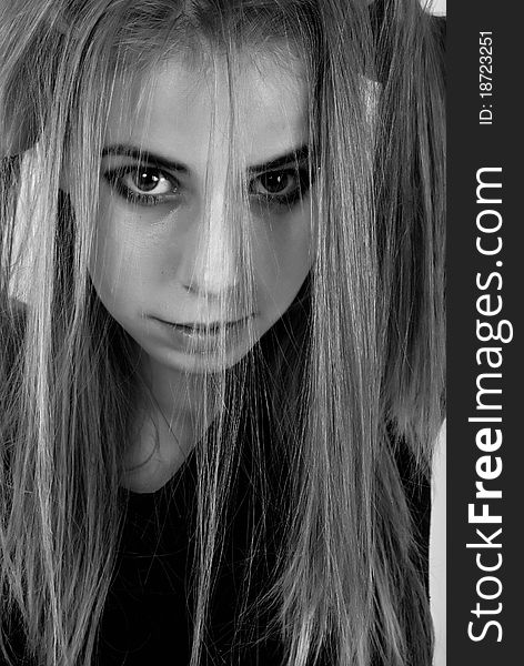 Black and white portrait of a misterious teenage girl. Black and white portrait of a misterious teenage girl