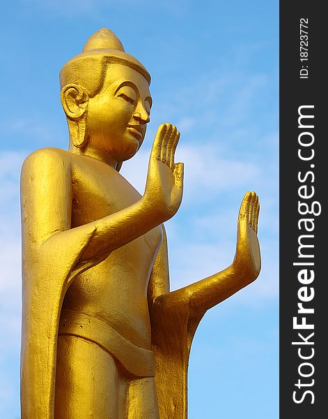 Statue of the Buddha on the background of the blue sky. Statue of the Buddha on the background of the blue sky