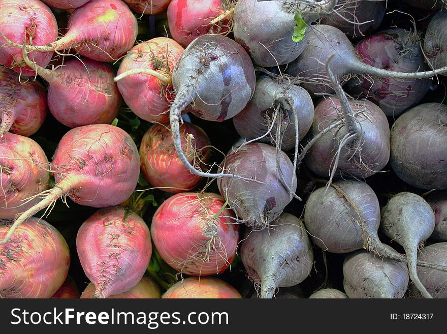 Red and purple beets piled up at farmer's market. Red and purple beets piled up at farmer's market