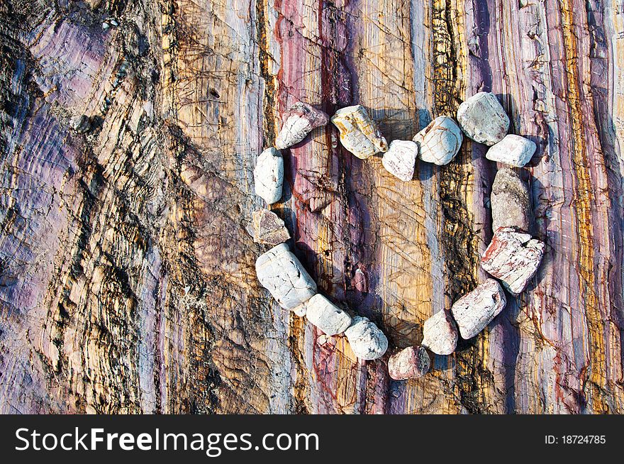 Stone Heart On Colourfull Rock Background