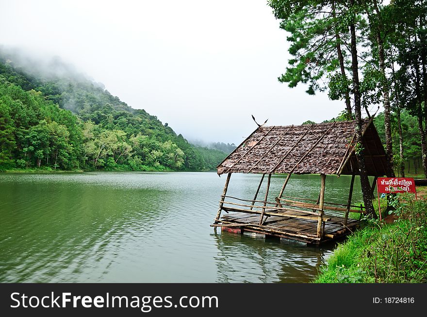Old hut on the river with cloudy day at Maehoungsorn Thailand