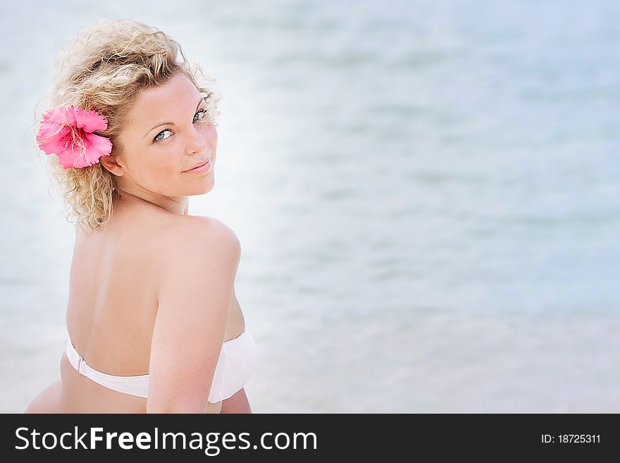 Young attractive woman relaxing on sea background