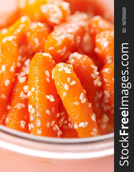 Honey glazed baby carrots with sesame seeds