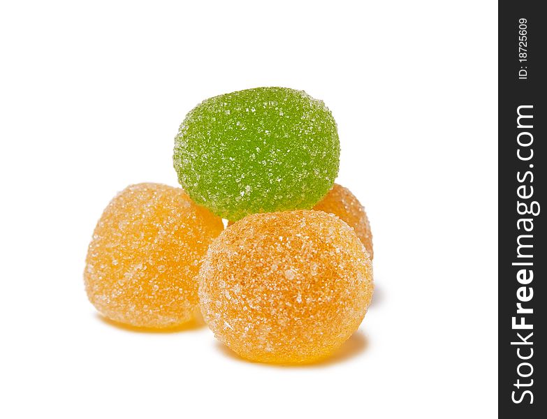 Jujube in sugar isolated over white. Focus is pointed on a green piece